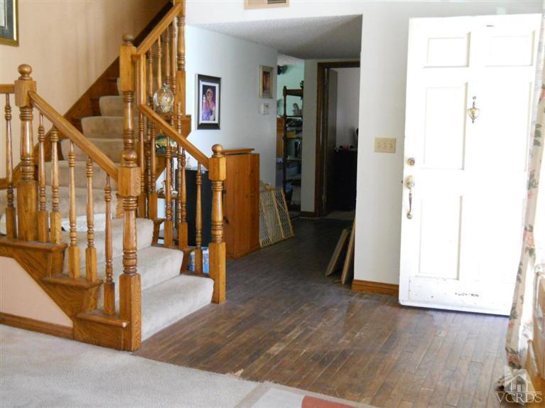 1740 Rivas Lane Oxnard, CA 93035 - Photo 23 of 30 a view of hallway with stairs and wooden floor