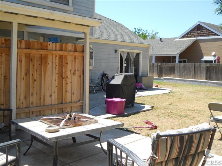 1740 Rivas Lane Oxnard, CA 93035 - Photo 25 of 30 a view of a patio with table and chairs with wooden floor and plants