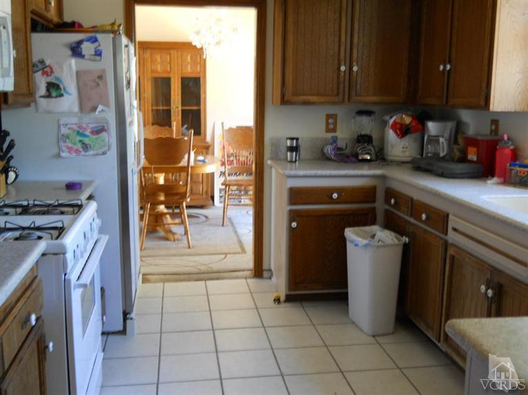 1740 Rivas Lane Oxnard, CA 93035 - Photo 9 of 30 a kitchen with a sink and cabinets