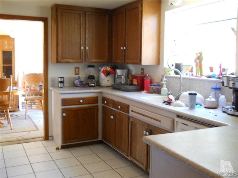 1740 Rivas Lane Oxnard, CA 93035 - Photo 10 of 30 a kitchen with a sink cabinets and a microwave