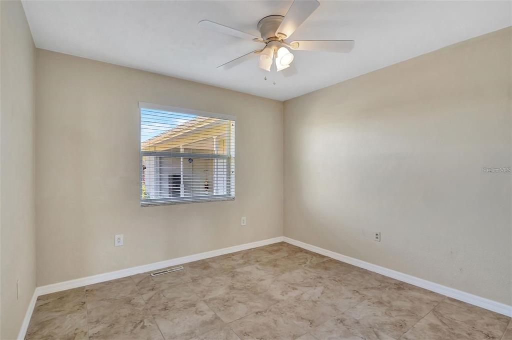 250 Bangsberg Road Southeast Port Charlotte, FL 33952 - Photo 17 of 59 an empty room with a window