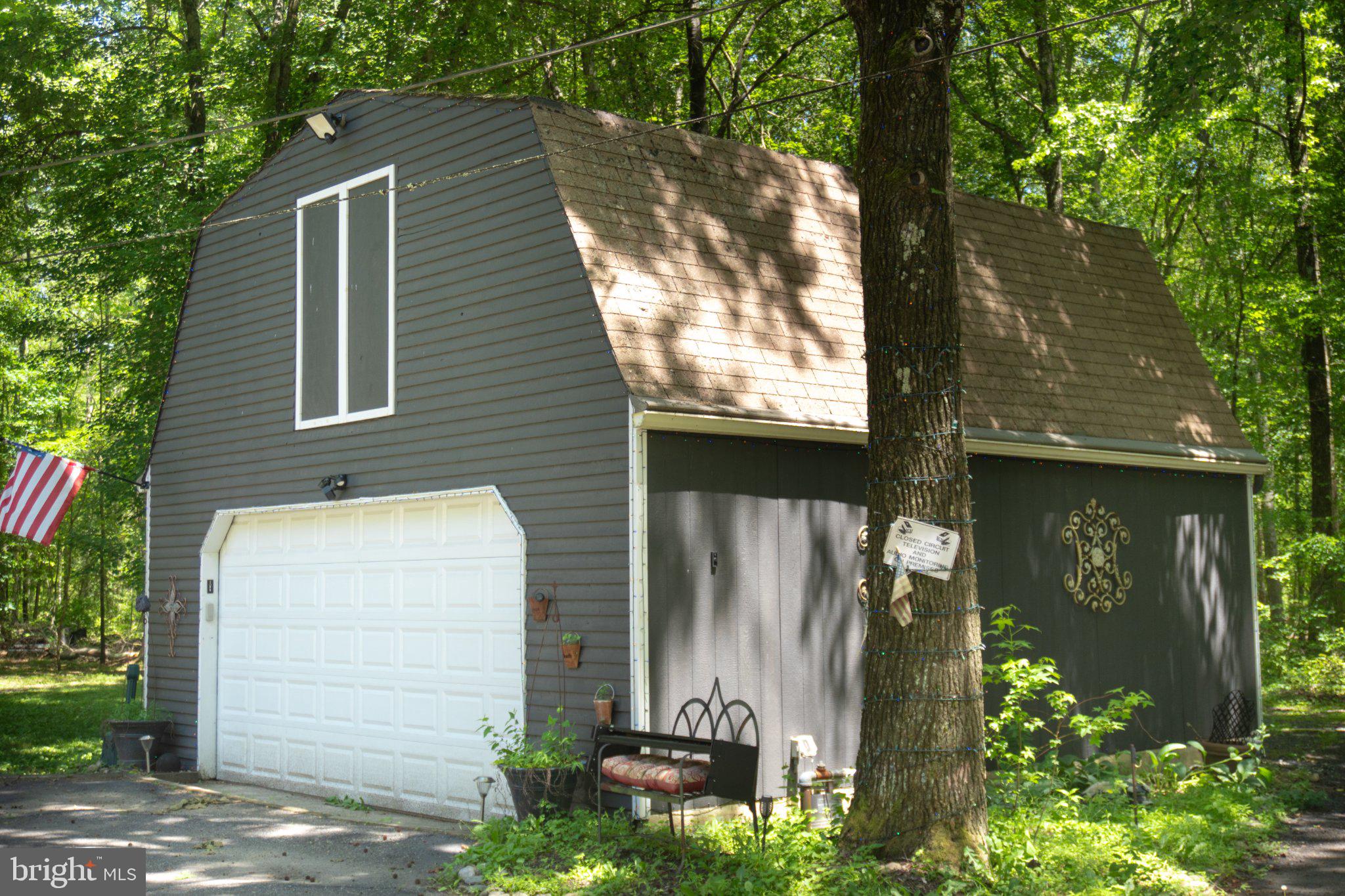 29 Friendship Road Southampton, NJ 08088 - Photo 5 of 28 Charming cabin nestled in lush greenery.
