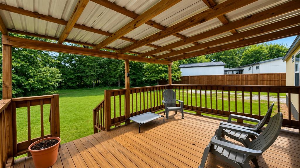 741 Waterfront Row Quitman, TX 75783 - Photo 22 of 40 a view of a wooden deck with furniture