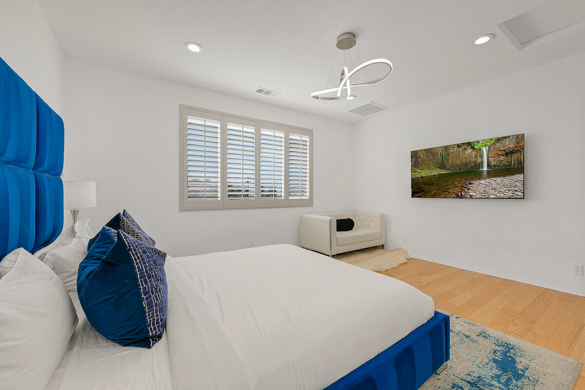 84325 Canzone Drive Indio, CA 92203 - Photo 14 of 53 a bedroom with a bed and a flat screen tv