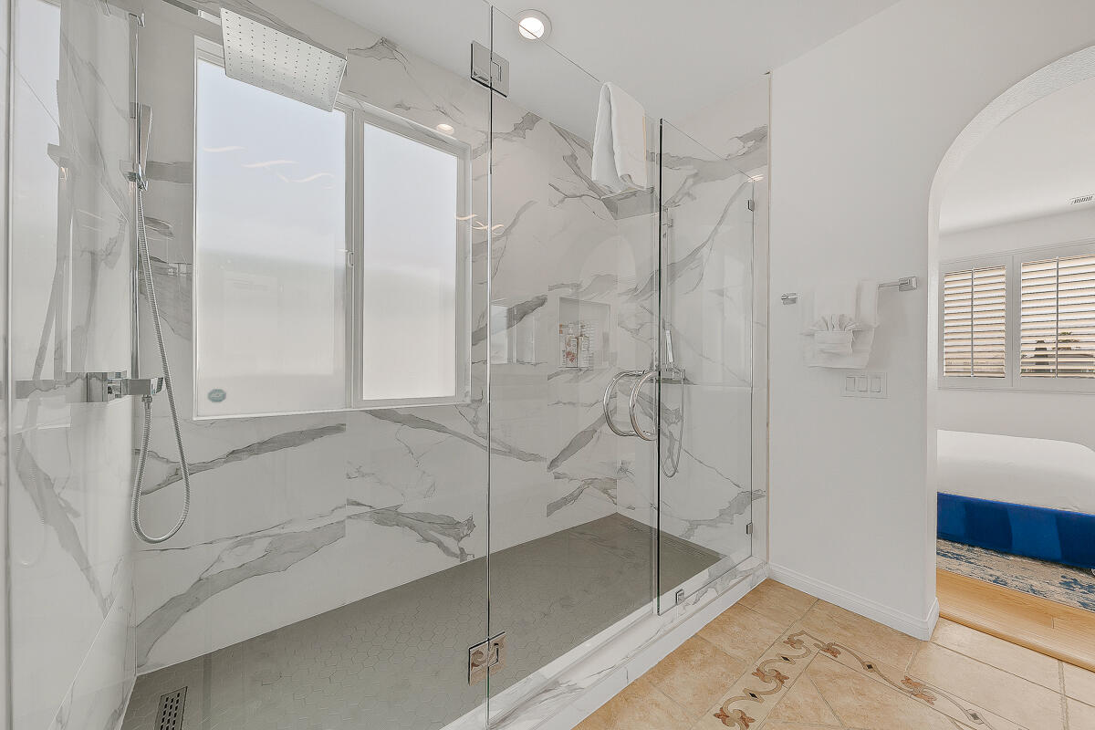 84325 Canzone Drive Indio, CA 92203 - Photo 17 of 53 a bathroom with a bathtub and a shower