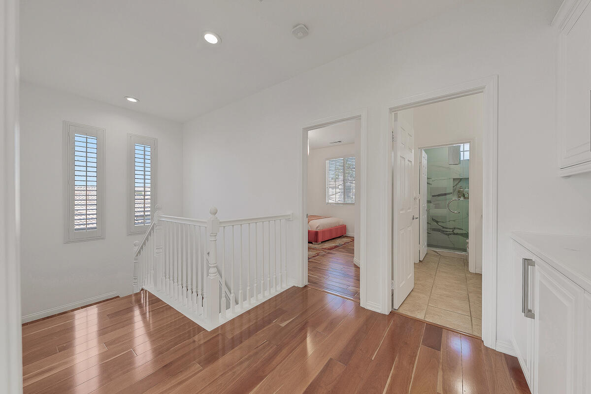 84325 Canzone Drive Indio, CA 92203 - Photo 19 of 53 wooden floor in an empty room with a window