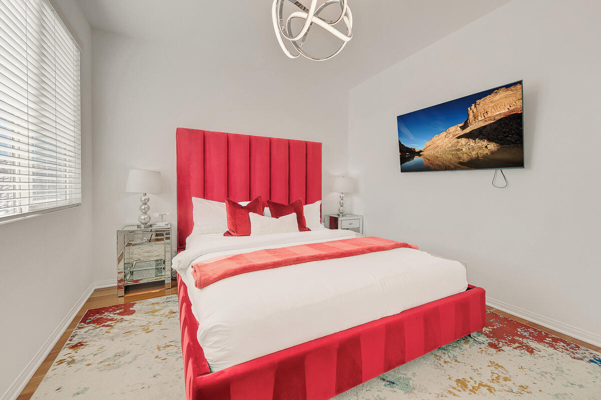 84325 Canzone Drive Indio, CA 92203 - Photo 24 of 53 a bedroom with a bed and a painting on the wall