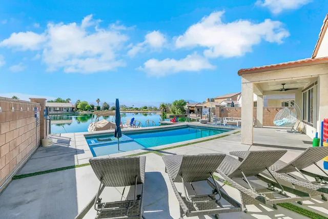 a view of balcony with table and chairs