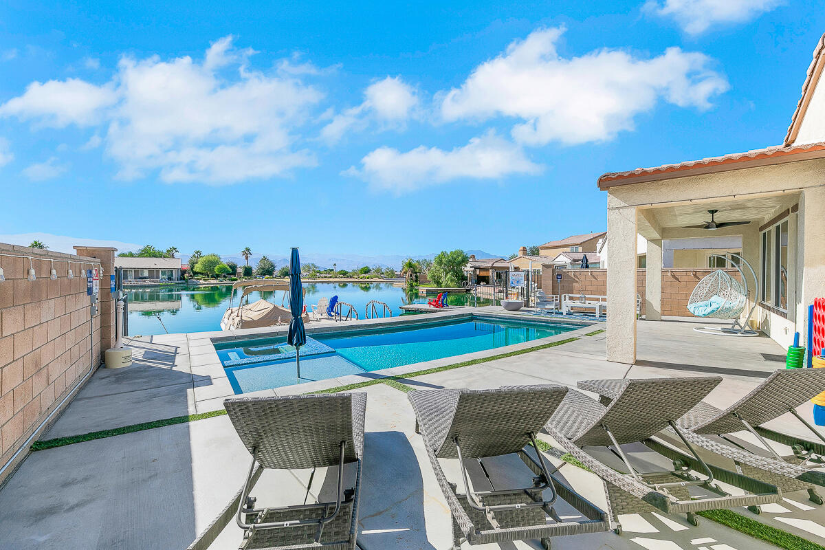 84325 Canzone Drive Indio, CA 92203 - Photo 33 of 53 a view of a chairs and table on the terrace