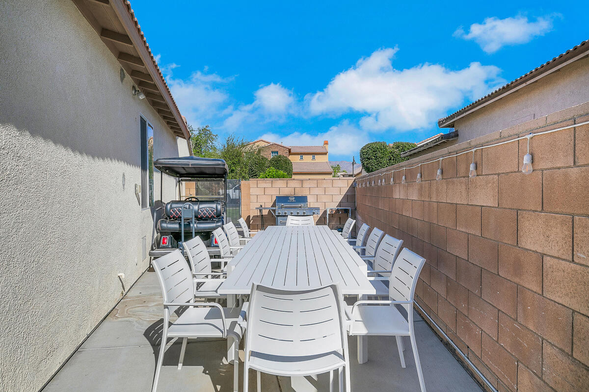 84325 Canzone Drive Indio, CA 92203 - Photo 34 of 53 a view of balcony with table and chairs
