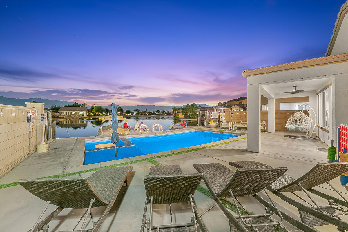 84325 Canzone Drive Indio, CA 92203 - Photo 39 of 53 a view of a swimming pool with an outdoor seating