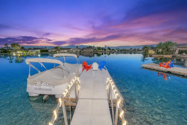 a view of a lake in front of the house