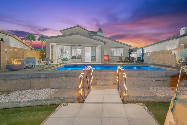 a view of a swimming pool with an outdoor seating
