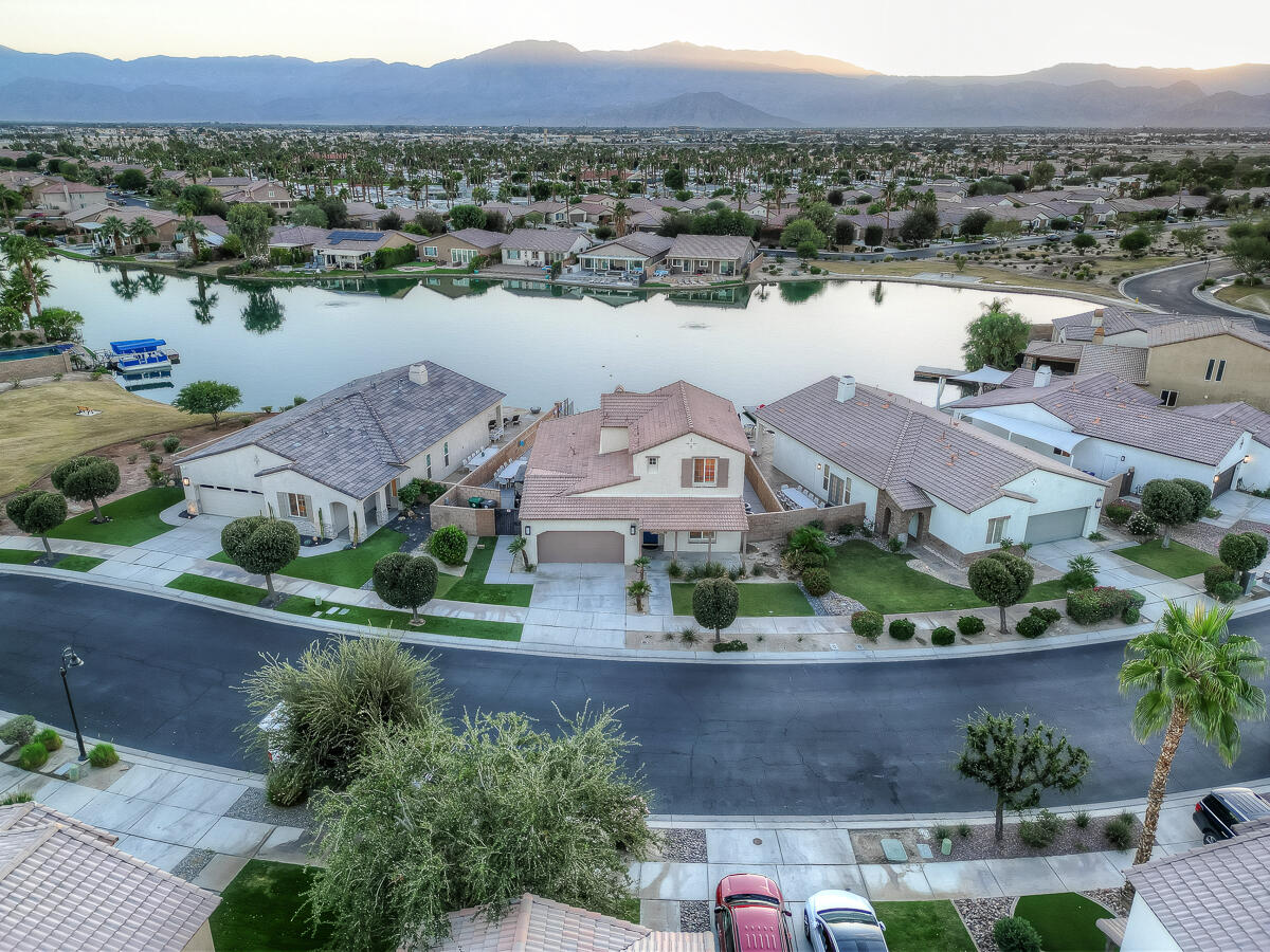 84325 Canzone Drive Indio, CA 92203 - Photo 48 of 53 an aerial view of a house with a lake view