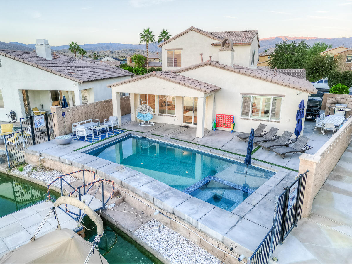 84325 Canzone Drive Indio, CA 92203 - Photo 51 of 53 a view of a house with pool and chairs
