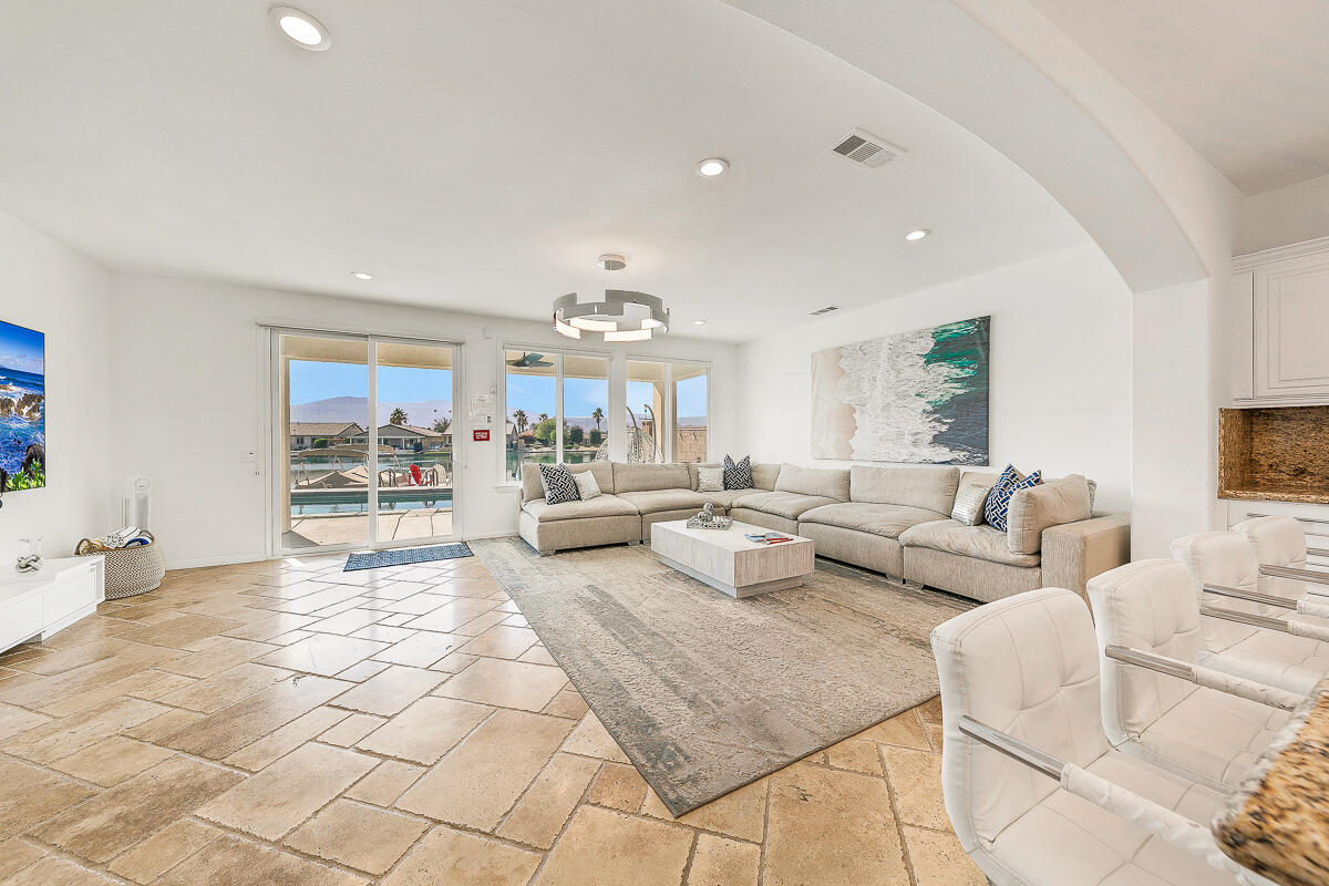 84325 Canzone Drive Indio, CA 92203 - Photo 9 of 53 a living room with furniture and a chandelier