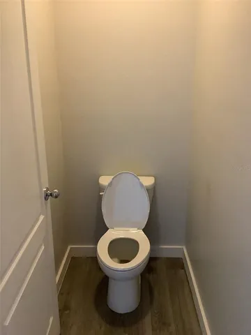 a white toilet sitting in a bathroom