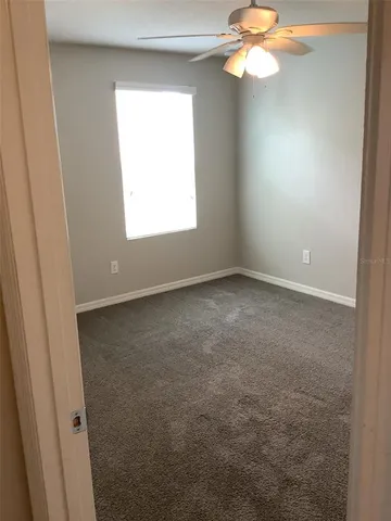 a bathroom with a granite countertop toilet a sink and shower