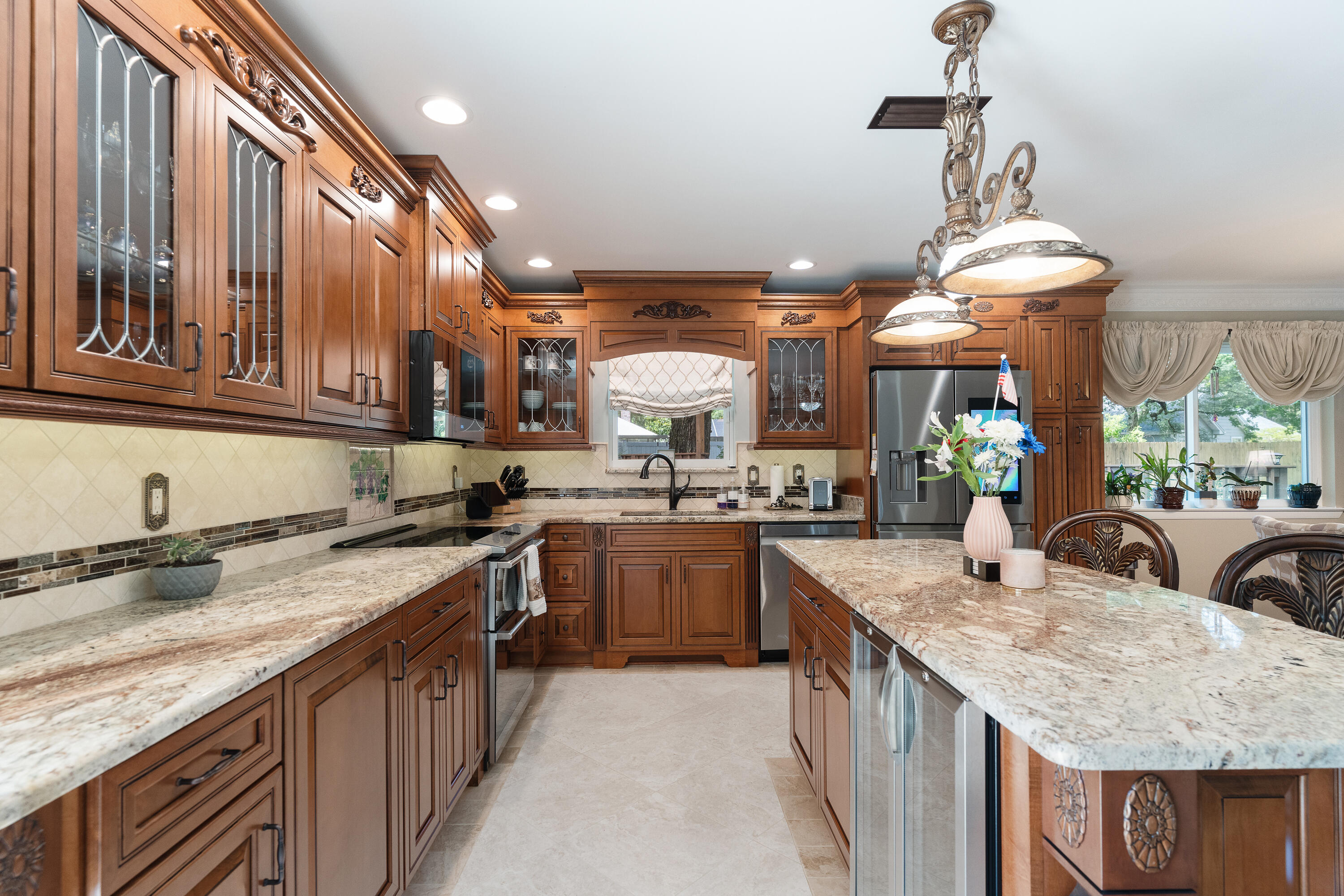 149 Raintree Boulevard Niceville, FL 32578 - Photo 12 of 72 a kitchen with stainless steel appliances granite countertop a sink a stove and a wooden floors