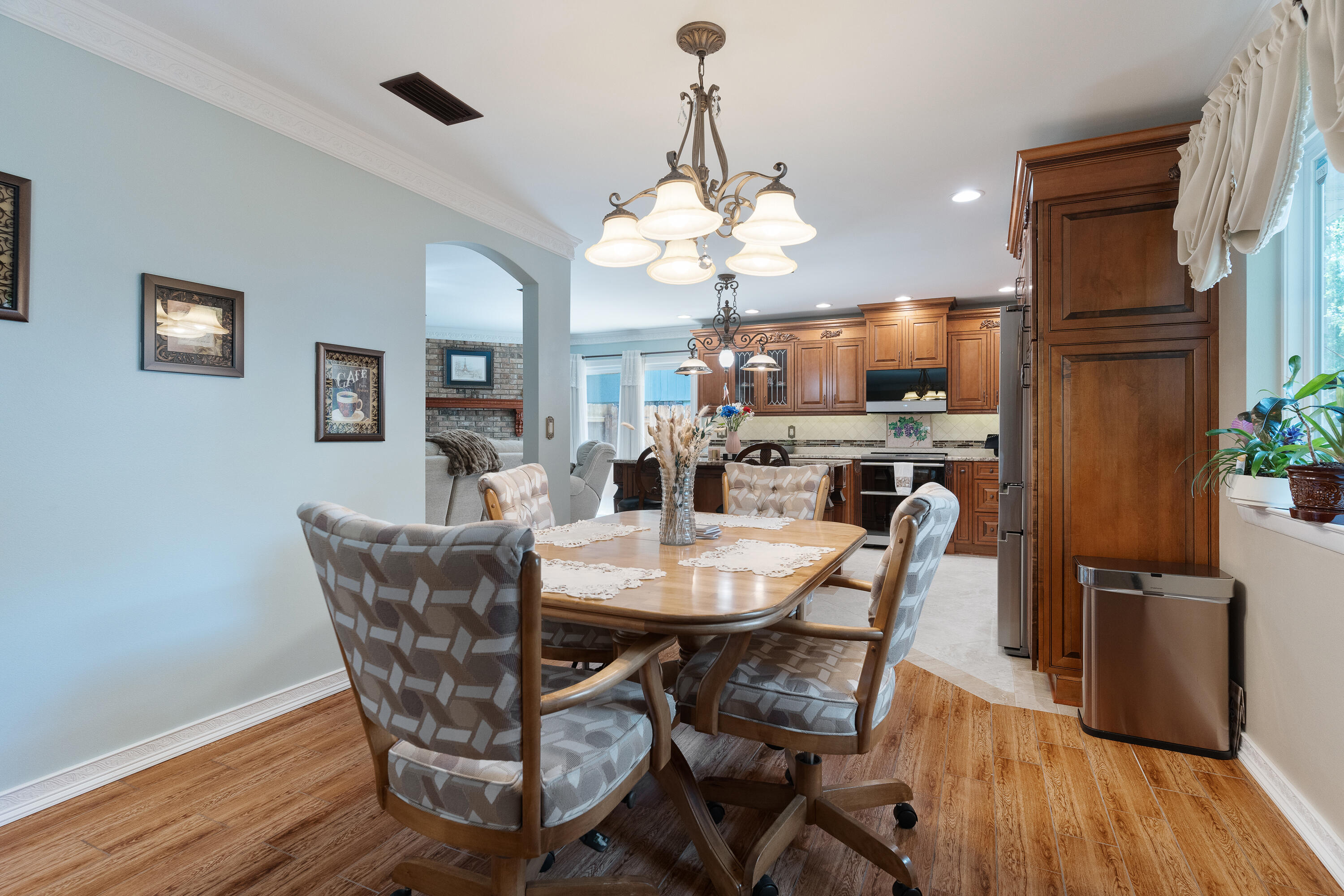 149 Raintree Boulevard Niceville, FL 32578 - Photo 22 of 72 a view of a dining room with furniture wooden floor and chandelier