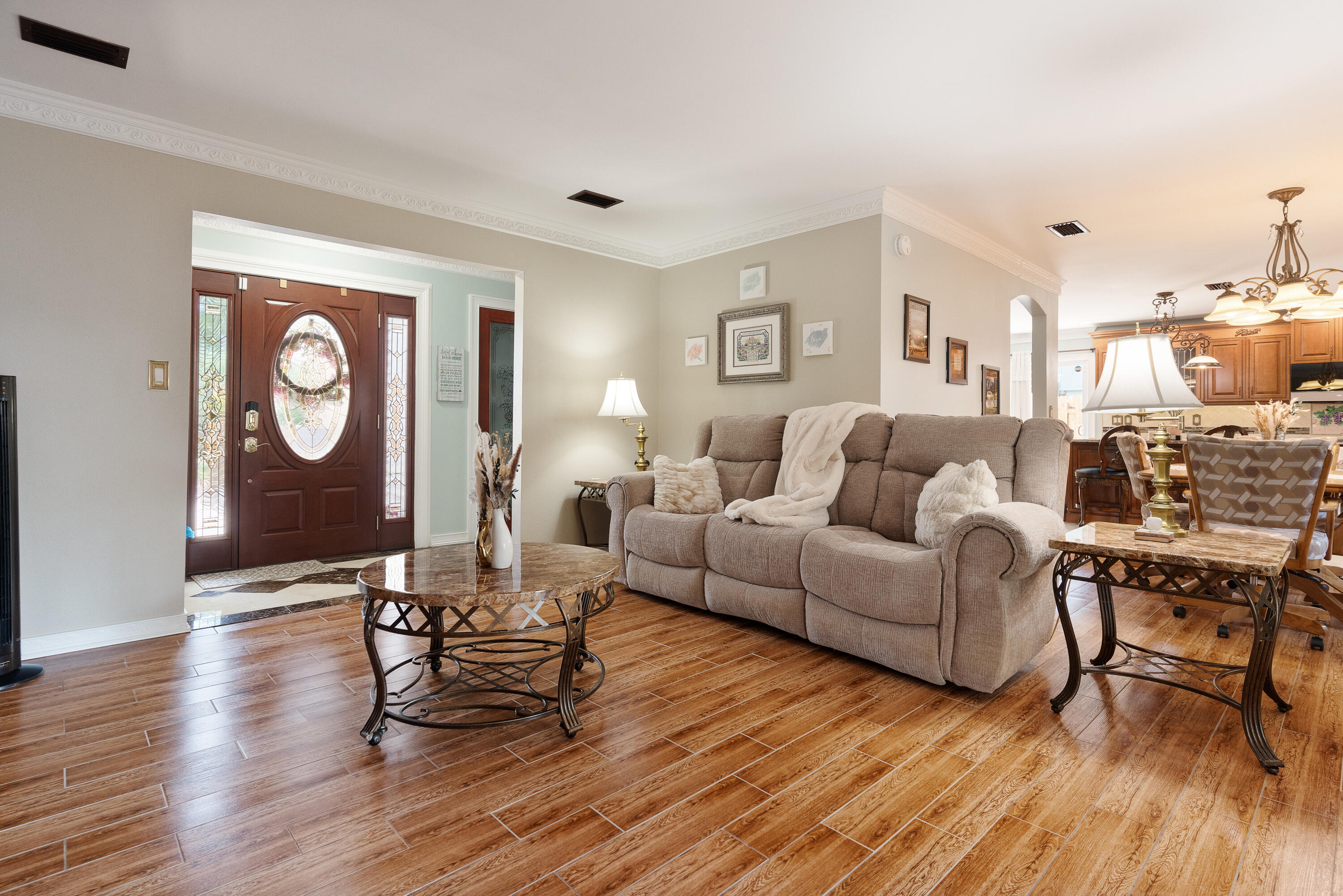 149 Raintree Boulevard Niceville, FL 32578 - Photo 27 of 72 a living room with furniture and a wooden floor