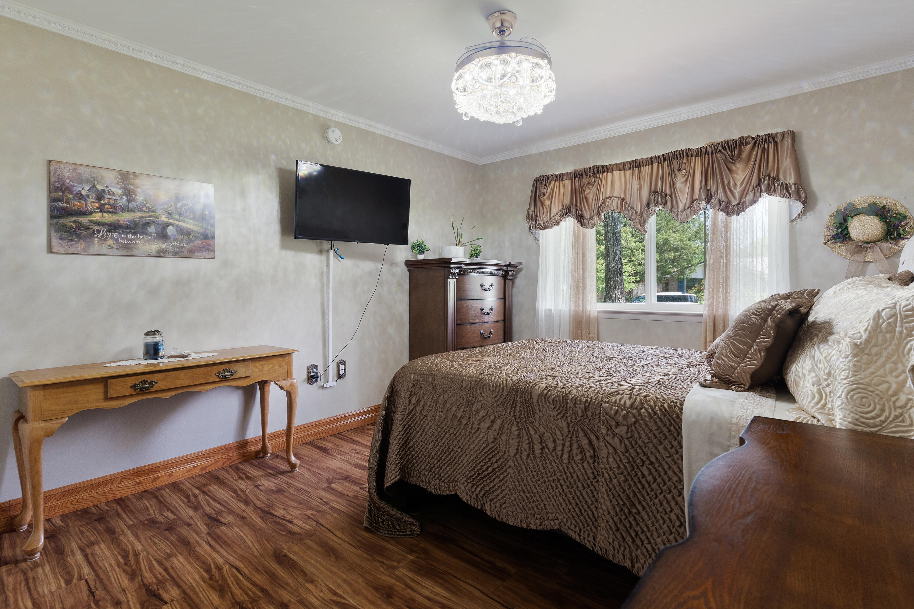 149 Raintree Boulevard Niceville, FL 32578 - Photo 36 of 72 a bedroom with a bed and a flat screen tv