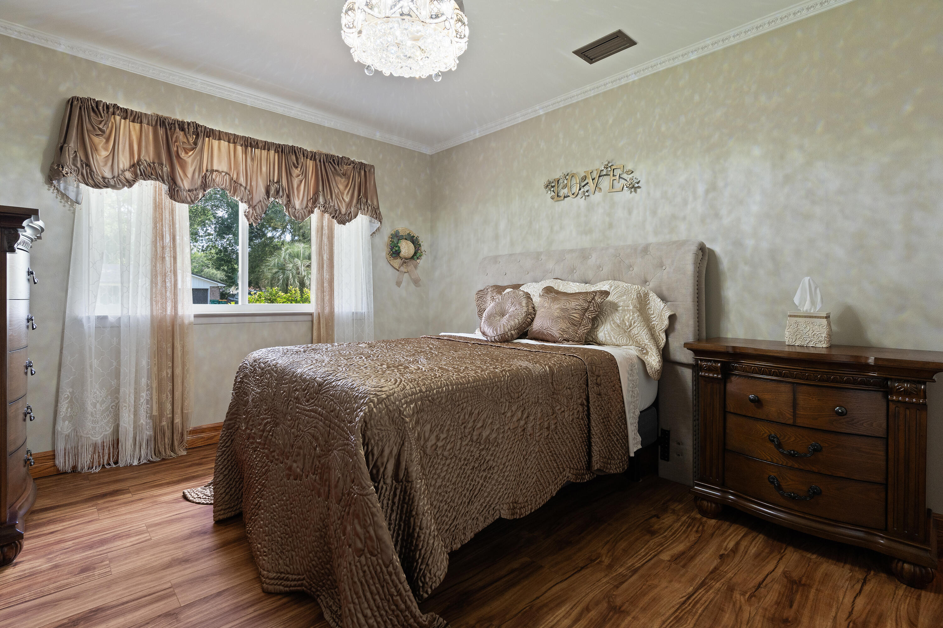 149 Raintree Boulevard Niceville, FL 32578 - Photo 37 of 72 a bedroom with a bed and a window