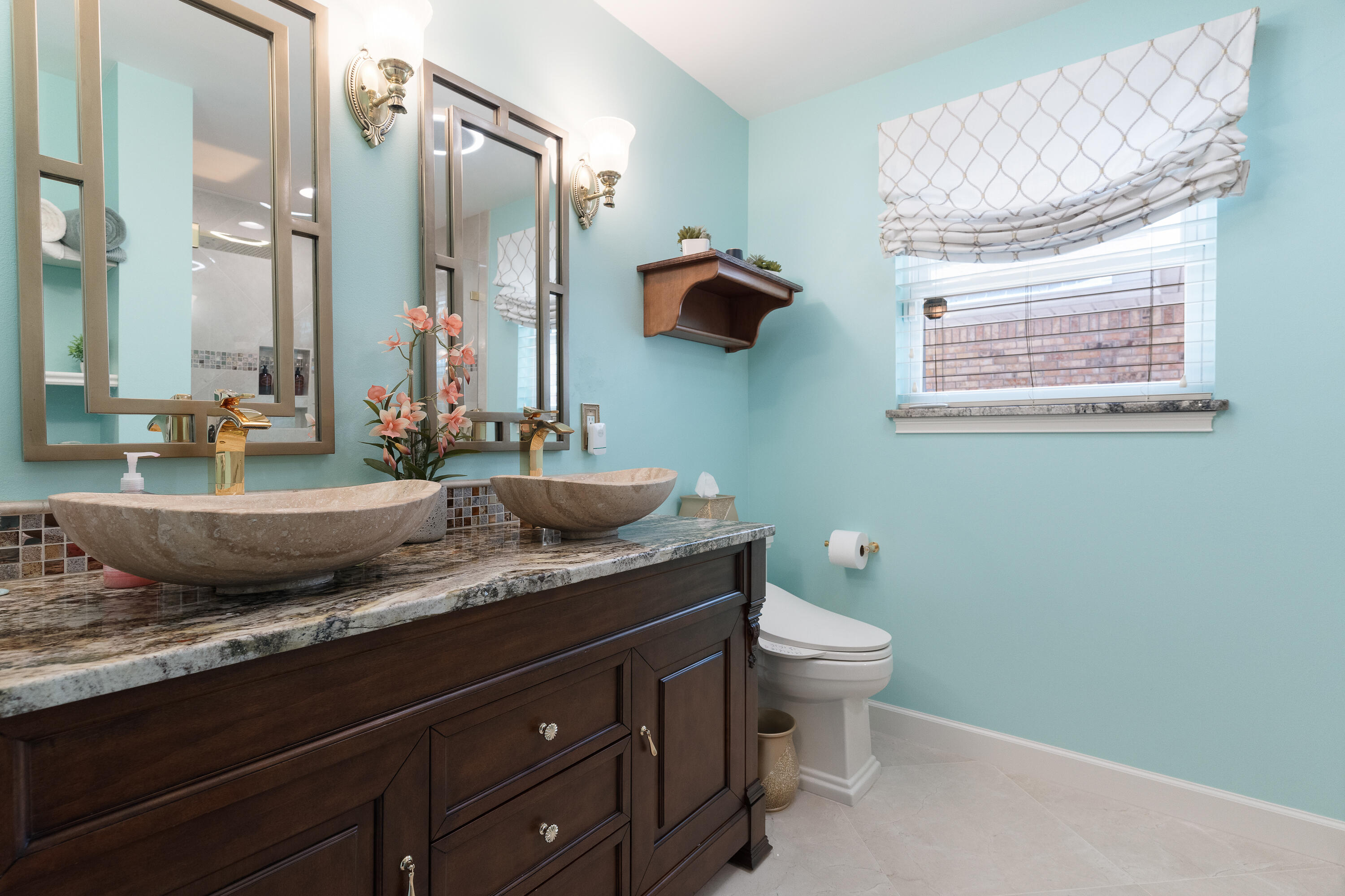149 Raintree Boulevard Niceville, FL 32578 - Photo 41 of 72 a bathroom with a granite countertop sink a mirror and a toilet