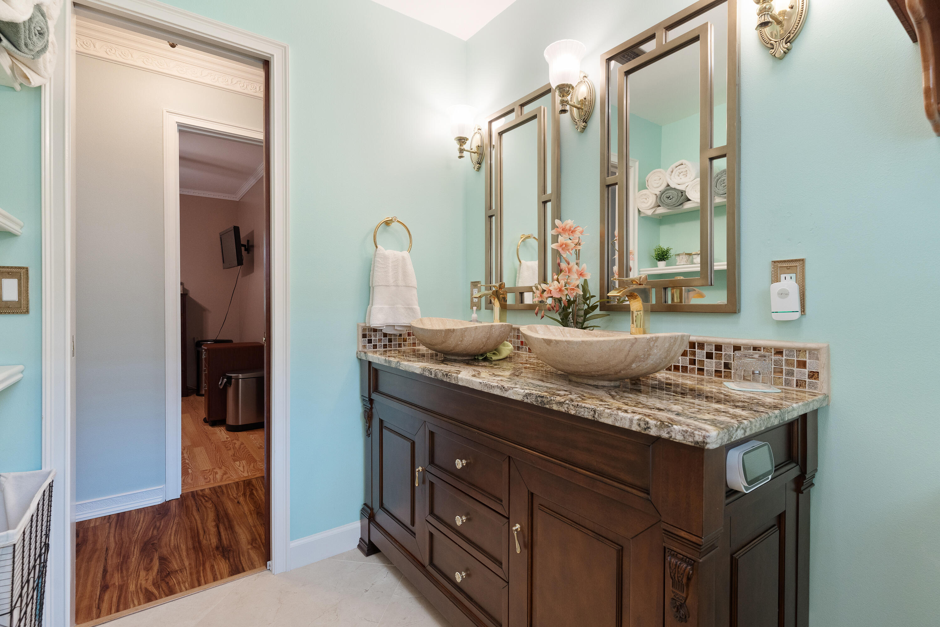149 Raintree Boulevard Niceville, FL 32578 - Photo 42 of 72 a bathroom with a granite countertop sink and a mirror