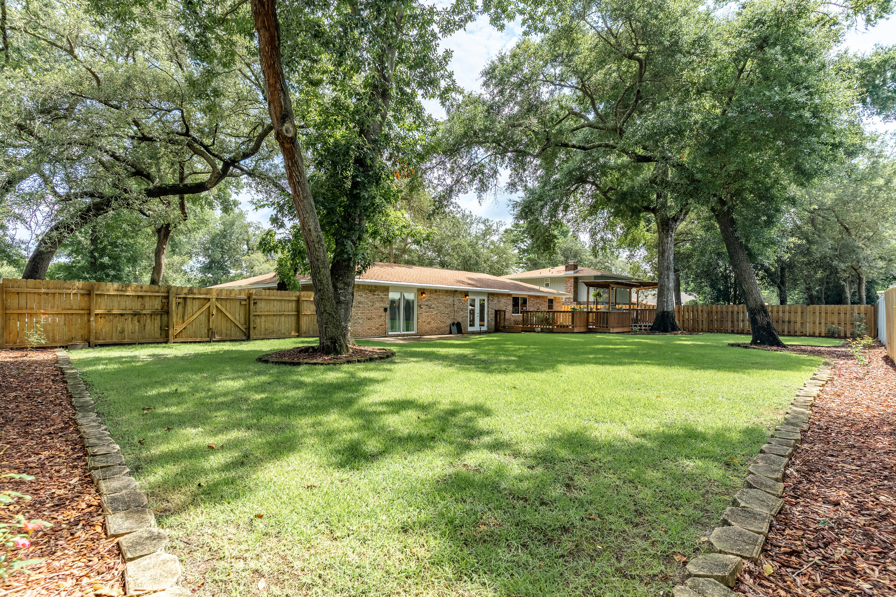 149 Raintree Boulevard Niceville, FL 32578 - Photo 46 of 72 a front view of a house with a yard