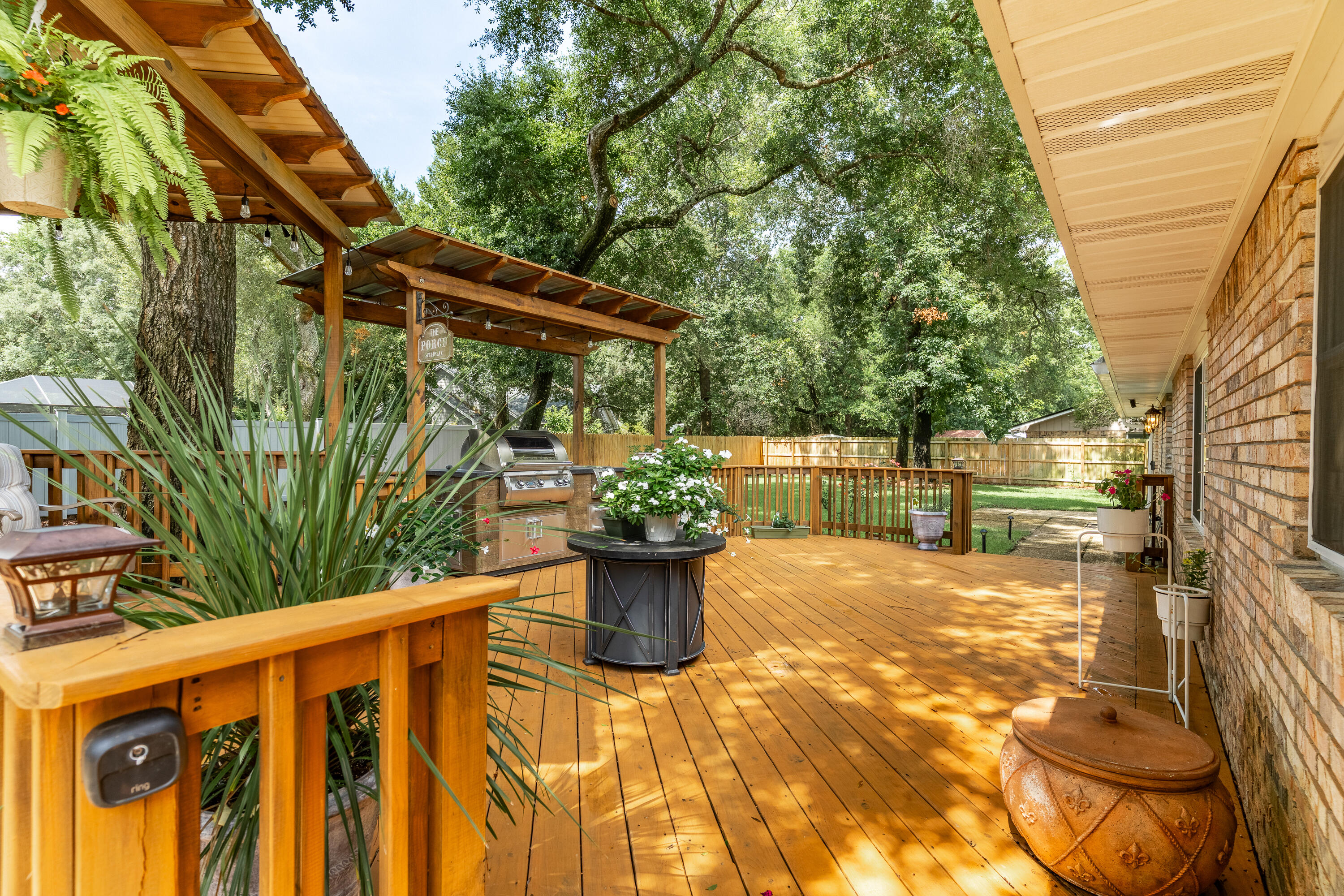 149 Raintree Boulevard Niceville, FL 32578 - Photo 51 of 72 a view of a backyard with potted plants