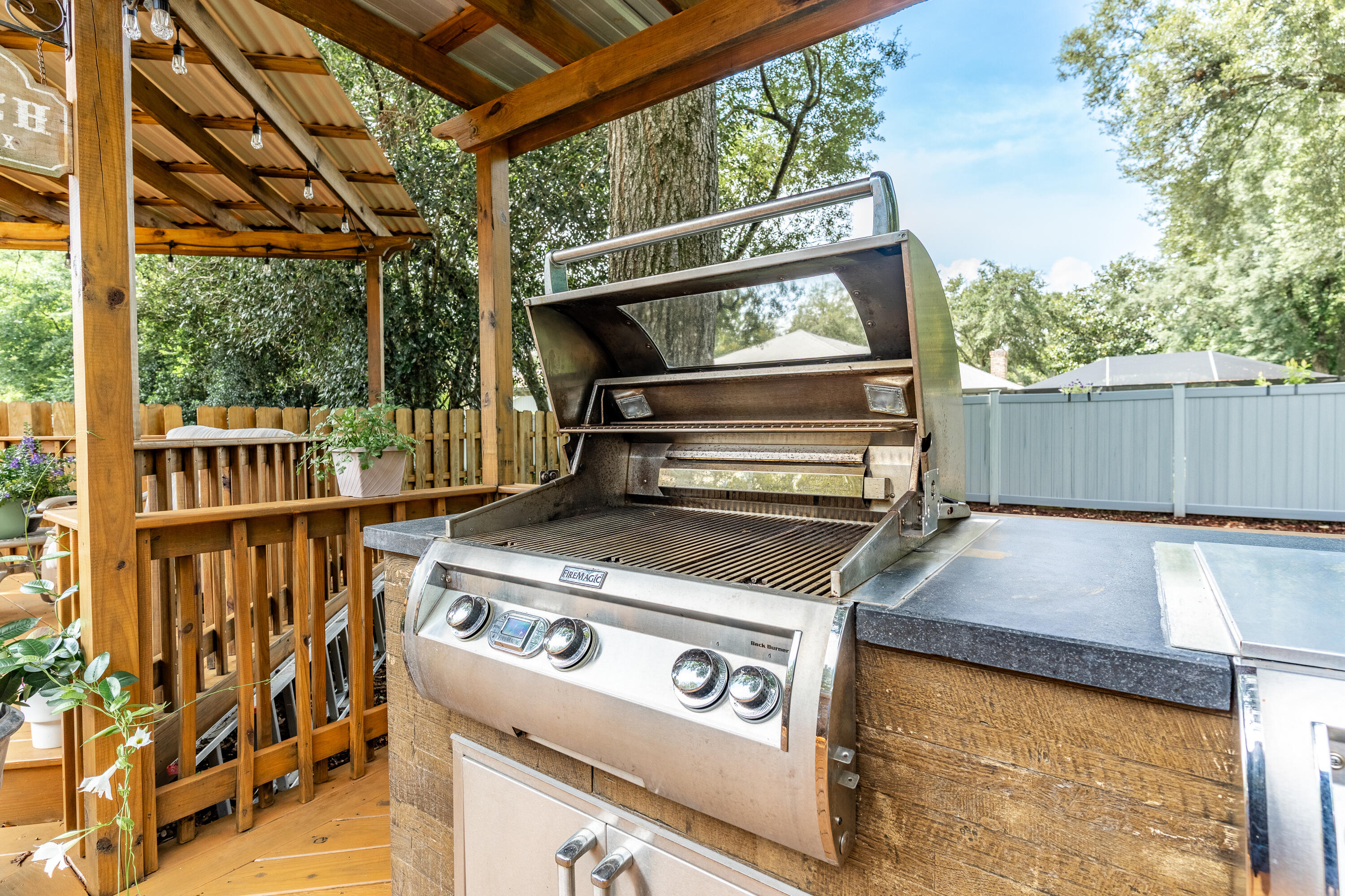 149 Raintree Boulevard Niceville, FL 32578 - Photo 55 of 72 a view of a backyard with table and chairs