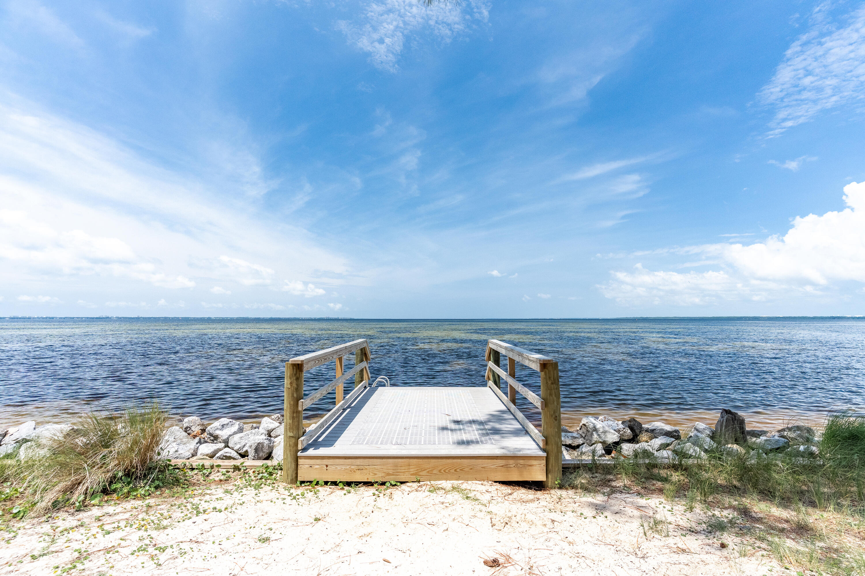 149 Raintree Boulevard Niceville, FL 32578 - Photo 71 of 72 a view of roof deck with two chairs and potted plants