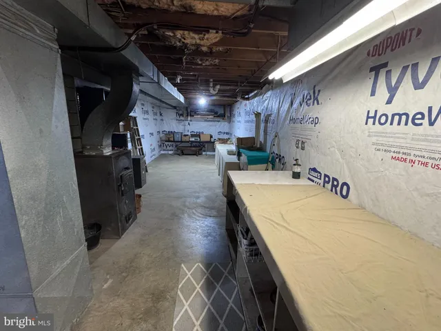 a view of a porch with a table and chairs and couches