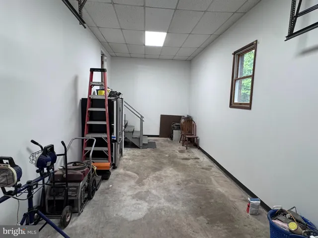 a view of a swimming pool with an outdoor space and seating area