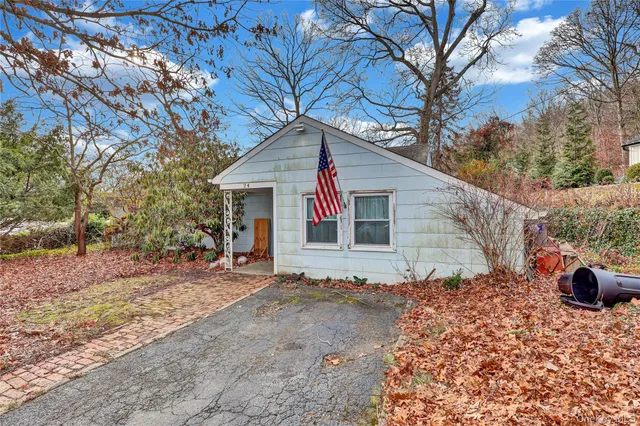 a view of backyard of house with green space