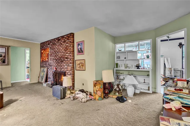 a view of livingroom with furniture and windows