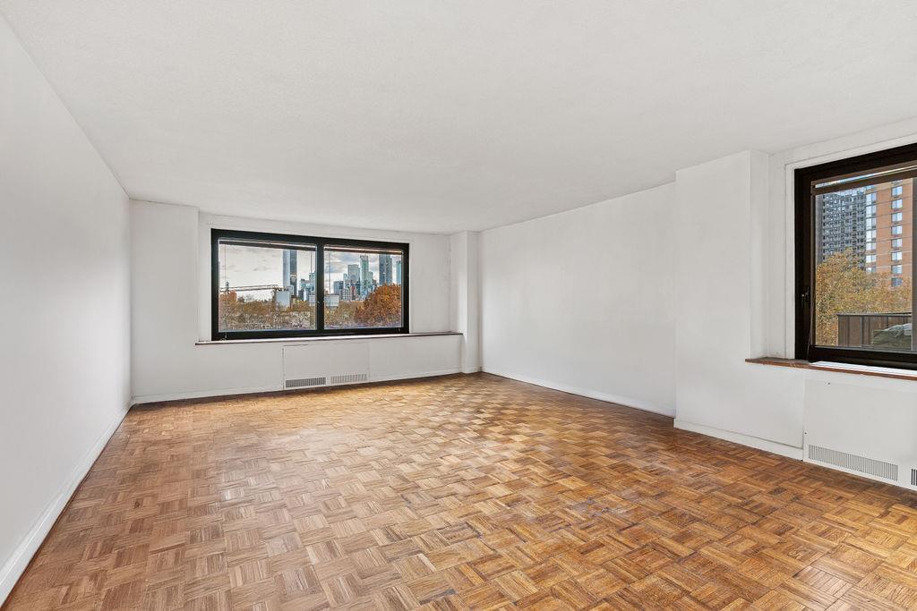 531 Main Street, Unit 504 Manhattan, NY 10044 - Photo 5 of 14 a view of an empty room with window