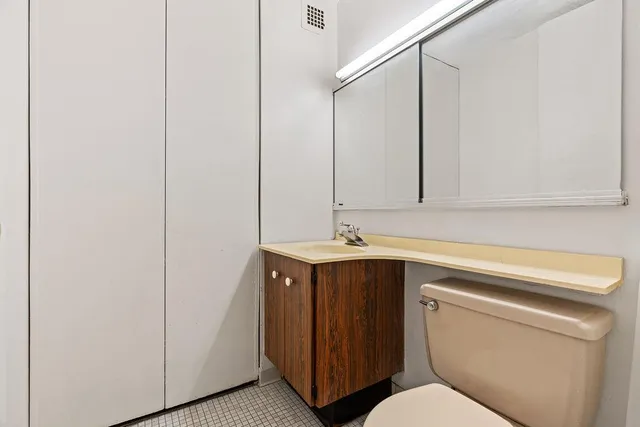 a large kitchen with stainless steel appliances granite countertop a sink and cabinets