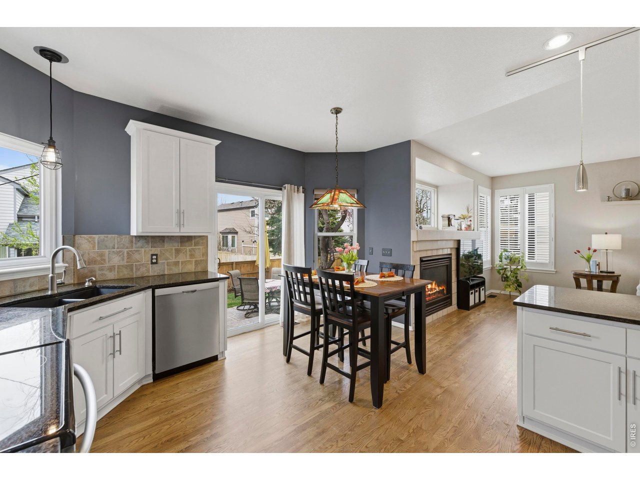9734 Red Oakes Drive Highlands Ranch, CO 80126 - Photo 12 of 40 a kitchen with lots of counter top space and dining table