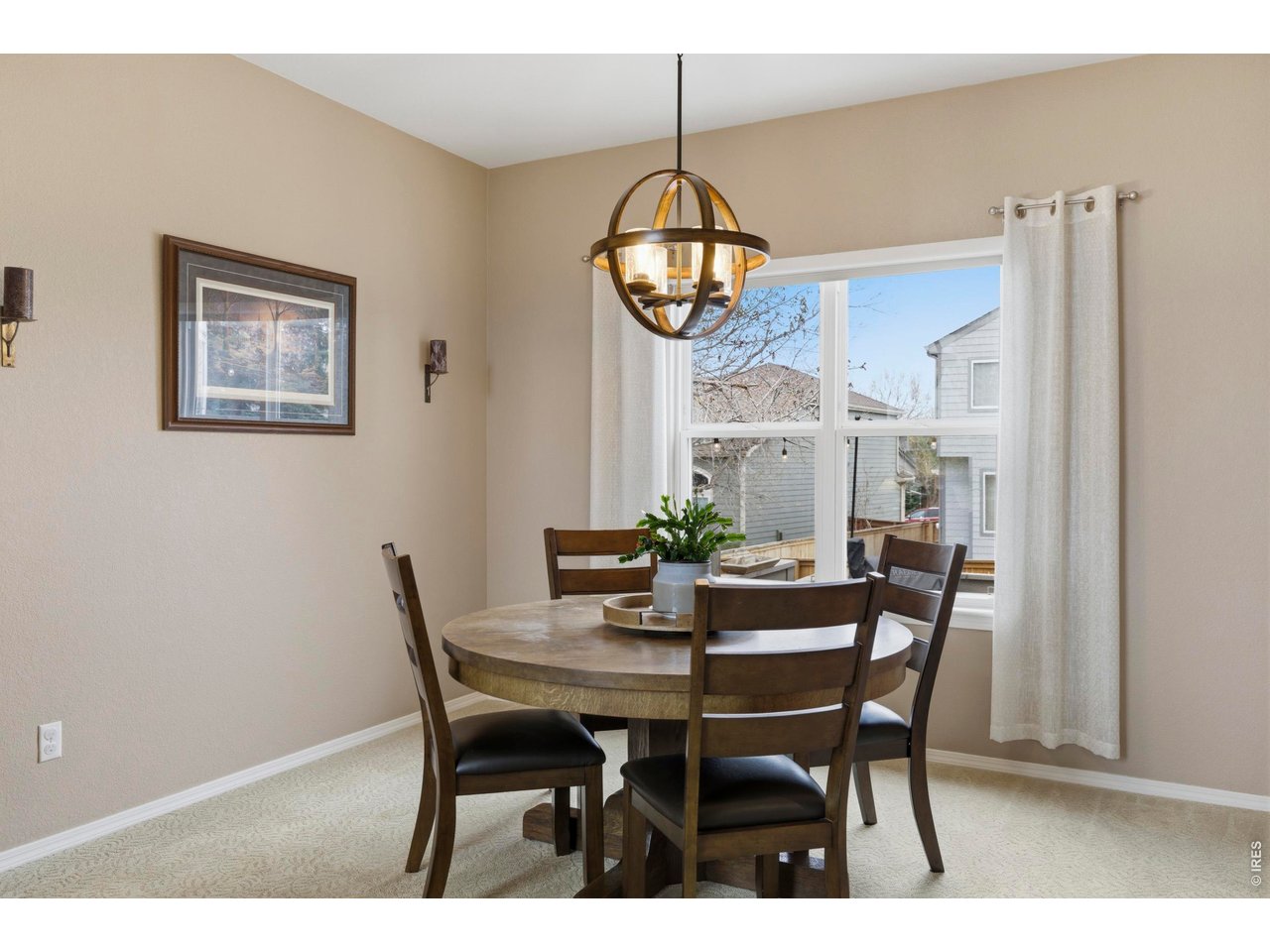 9734 Red Oakes Drive Highlands Ranch, CO 80126 - Photo 16 of 40 a view of a dining room with furniture window and wooden floor