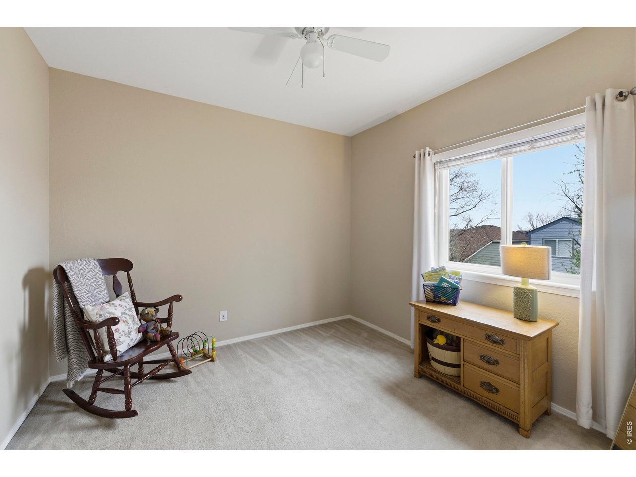 9734 Red Oakes Drive Highlands Ranch, CO 80126 - Photo 19 of 40 a room with furniture and window