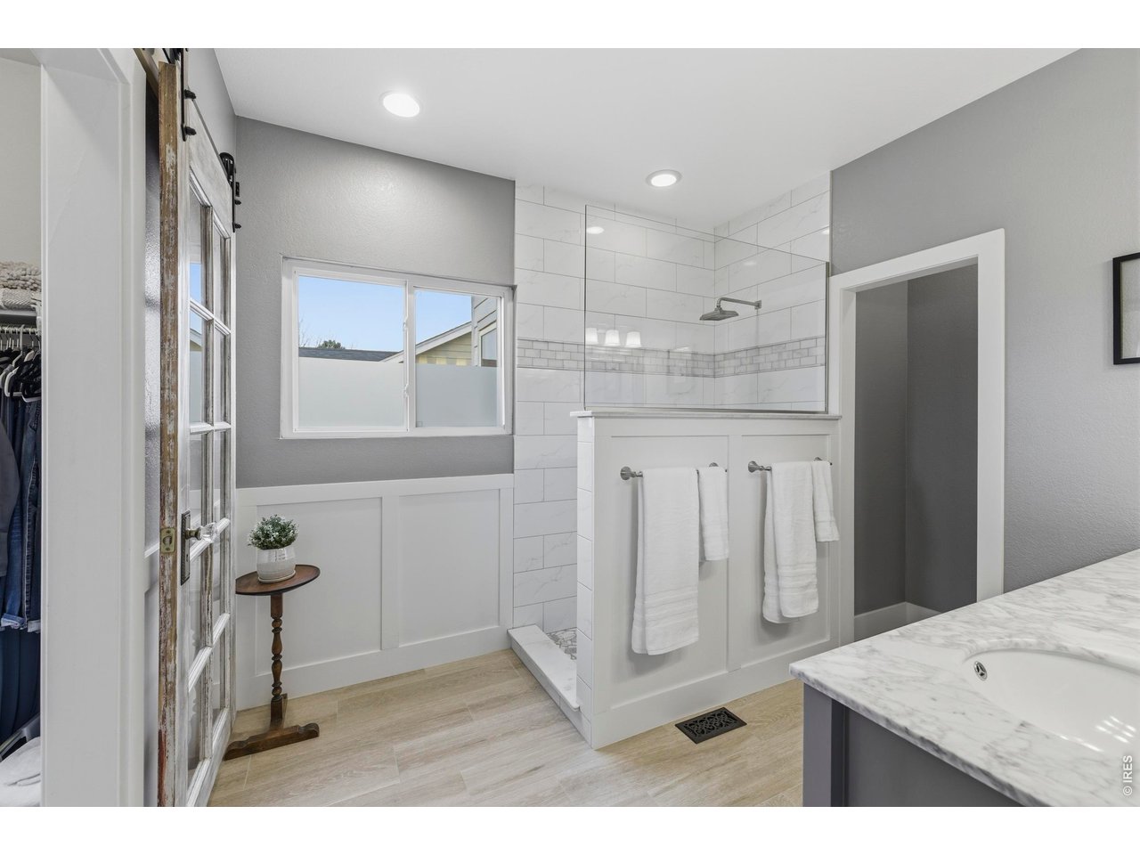 9734 Red Oakes Drive Highlands Ranch, CO 80126 - Photo 22 of 40 a bathroom with a granite countertop sink a mirror and shower