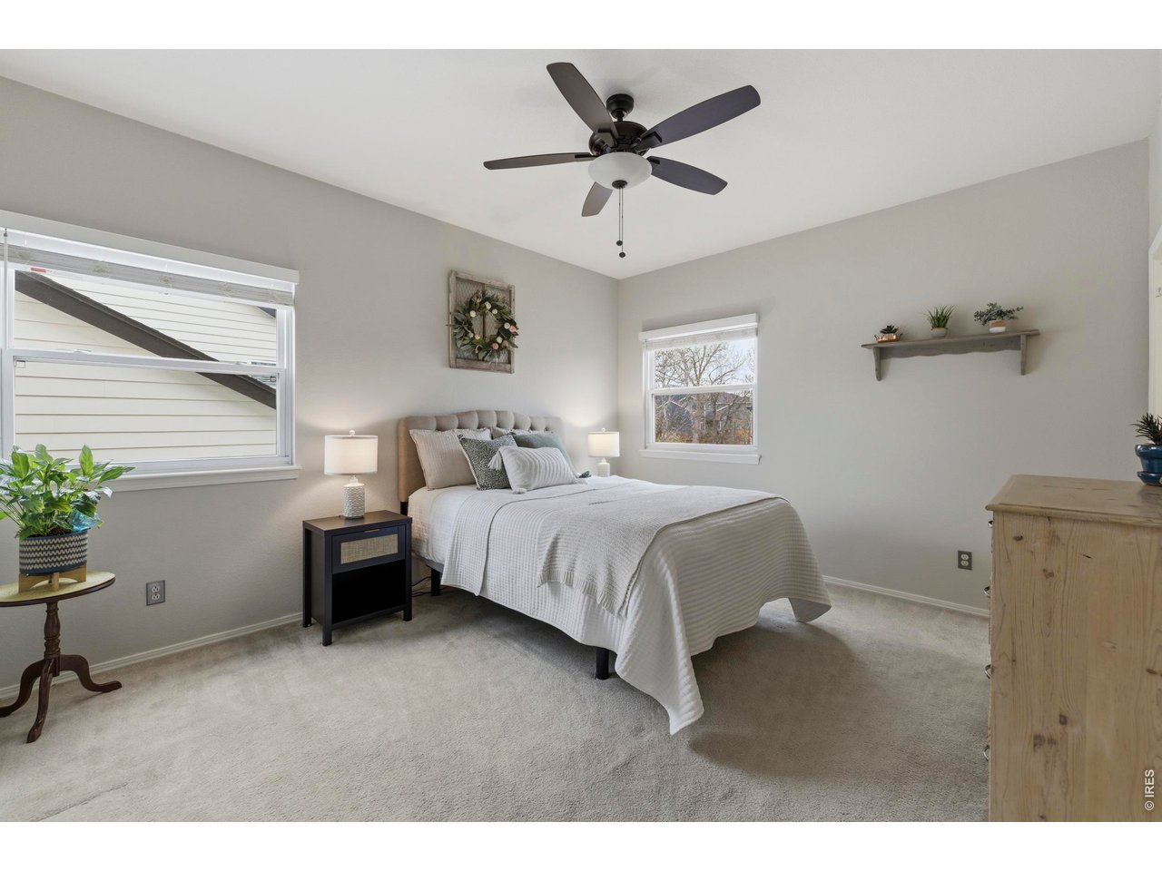 9734 Red Oakes Drive Highlands Ranch, CO 80126 - Photo 24 of 40 a bedroom with a bed and a potted plant