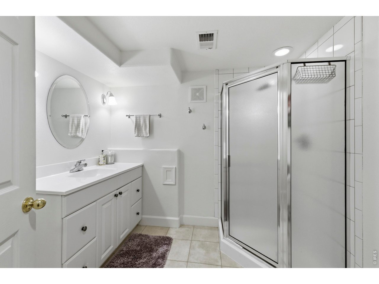 9734 Red Oakes Drive Highlands Ranch, CO 80126 - Photo 28 of 40 a bathroom with a double vanity sink mirror and shower