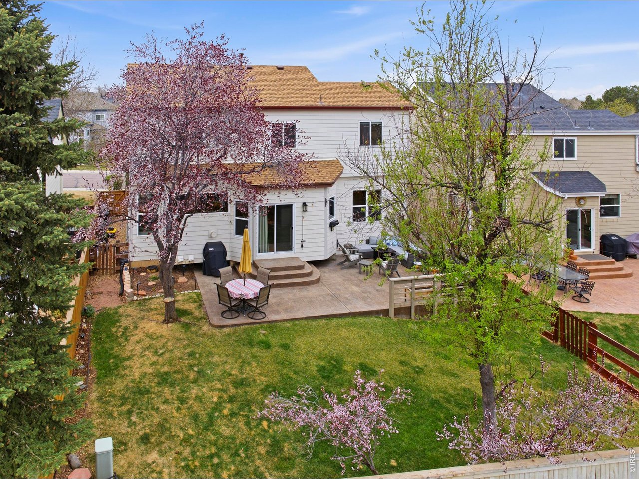 9734 Red Oakes Drive Highlands Ranch, CO 80126 - Photo 30 of 40 a view of a house with patio and a garden