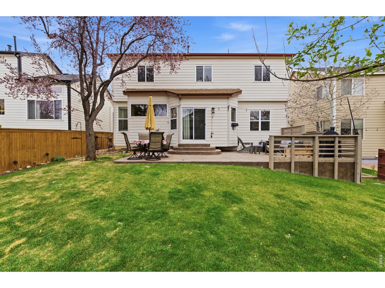 9734 Red Oakes Drive Highlands Ranch, CO 80126 - Photo 31 of 40 a front view of a house with a garden and plants