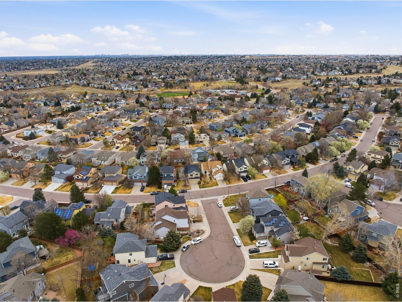9734 Red Oakes Drive Highlands Ranch, CO 80126 - Photo 38 of 40 an aerial view of a city with lots of residential buildings