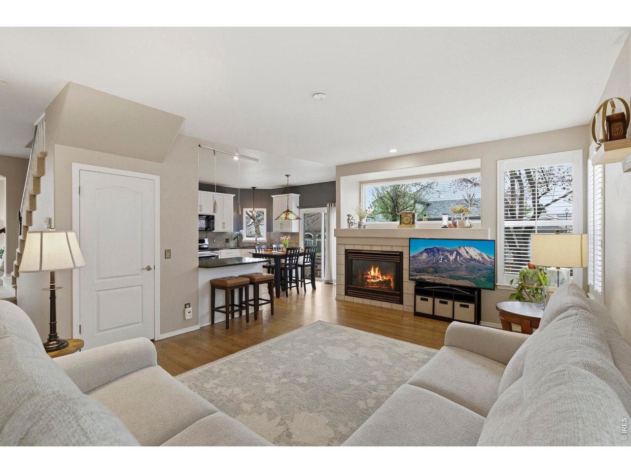 9734 Red Oakes Drive Highlands Ranch, CO 80126 - Photo 9 of 40 a living room with furniture a fireplace and a flat screen tv