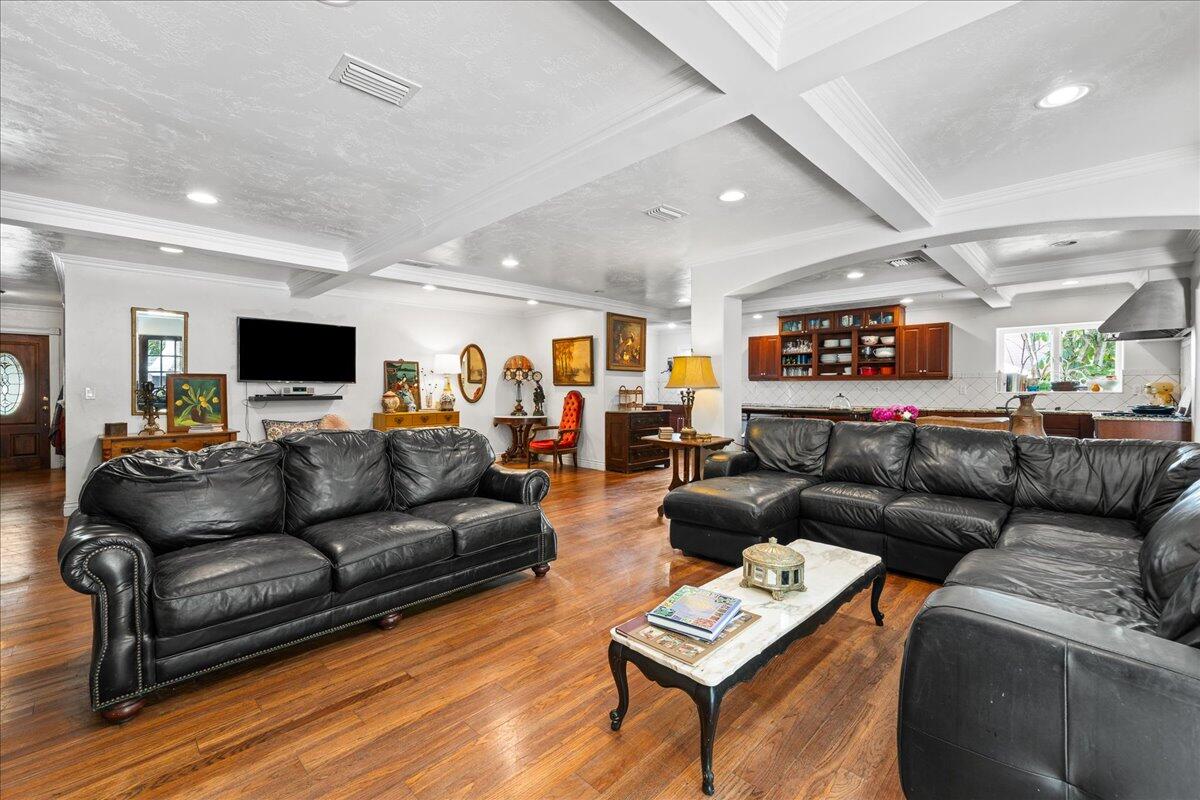 1244 Cimarron Circle Northeast Palm Bay, FL 32905 - Photo 11 of 38 a living room with furniture and a flat screen tv